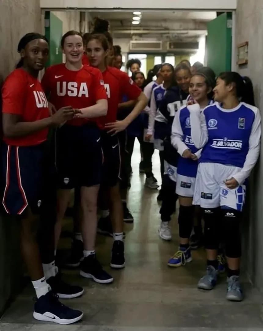Team USA’s U16 women’s basketball team standing next to El Salvador’s U16 team. The final score was 114 to 19. (2019)