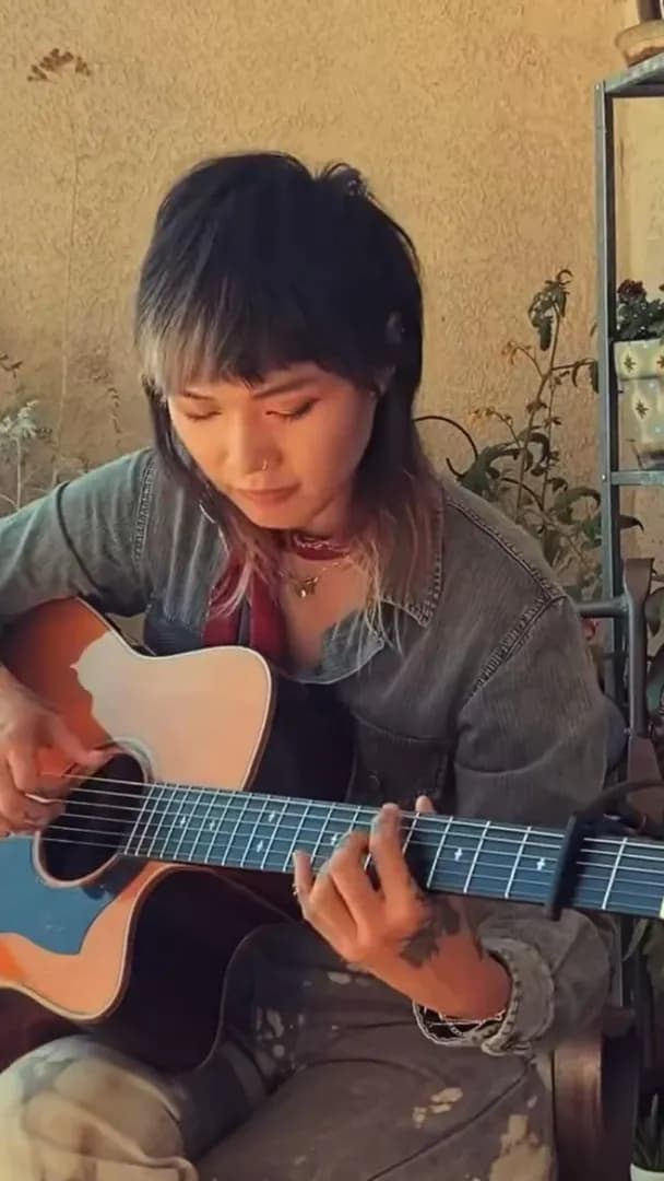 Yvette Young is a melodic echo chamber of finger tapping on both acoustic and electric guitar (electric guitar at 0:59)