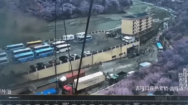 Mudslide engulfs Nepal-China border crossing as people attempt to flee.