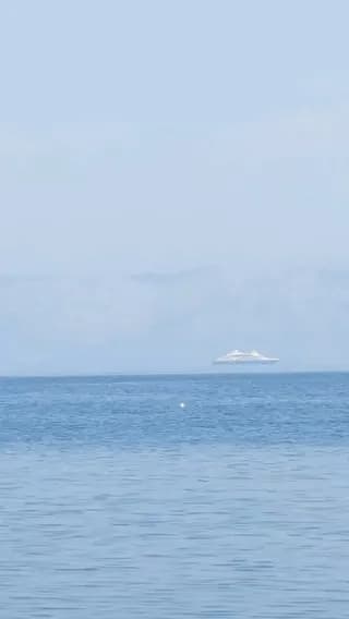 (OC) Fata morgana is a mirage effect where rising hot air causes ships to appear to be floating above the waves. Observed today in the mediterranean