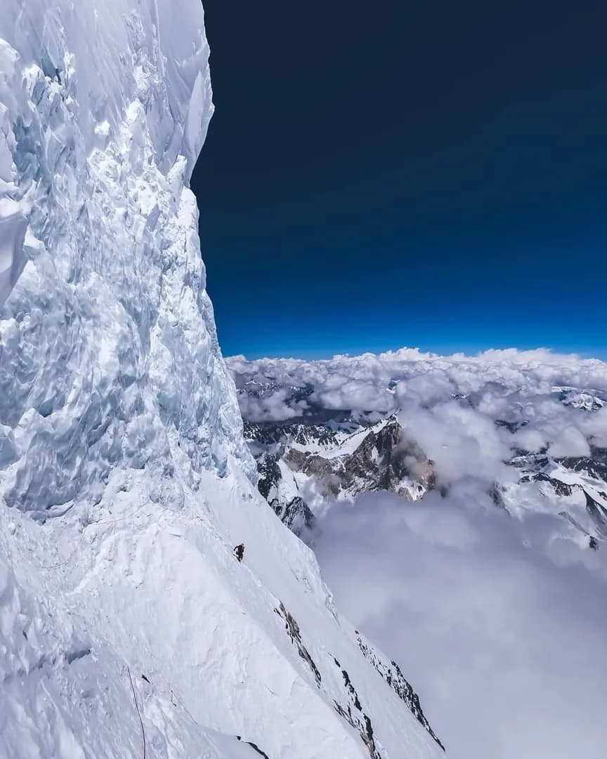 This is K2’s Bottleneck, a steep traverse above 8,000 metres beneath an enormous hanging serac capable of collapsing without warning. And somehow, this is considered the mountain’s standard route to t