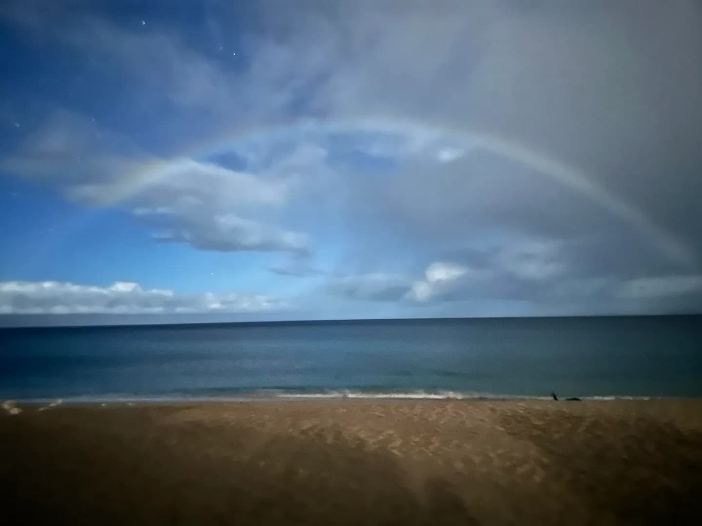 Nighttime Rainbow during a full moon and light rain (10 PM Maui, HI)