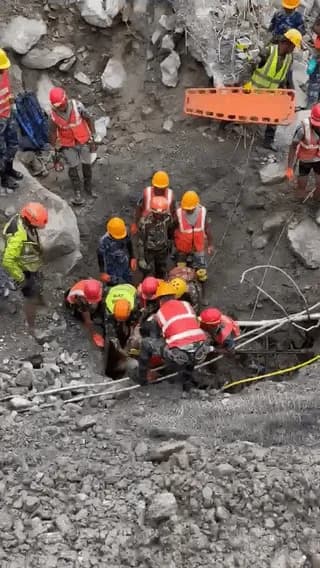 Two workers have been rescued alive from a flooded hydropower tunnel in Nepal after being trapped underground for nine days.