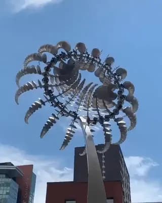 Anthony Howe is a kinetic sculptor who creates wind-driven sculptures resembling pulsing, alien creatures and vortices. This one is in downtown Montreal.