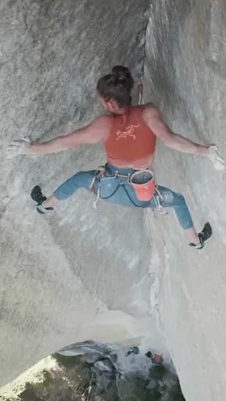 Amity Warme is a rock climber. She lives in a van and spends much of the year traveling to various climbing destinations. This clip shows her on the crux of this Yosemite climb, 150 feet in the air.