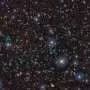 Extremely massive galaxy proto-supercluster smashes distance record