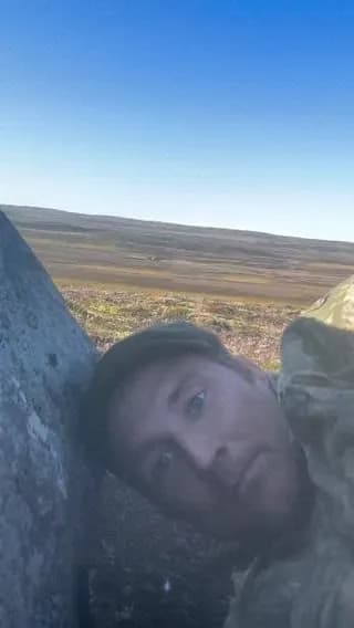 A wildlife photographer in Iceland captured a massive herd of reindeer coming within meters of him while he hid among the rocks.