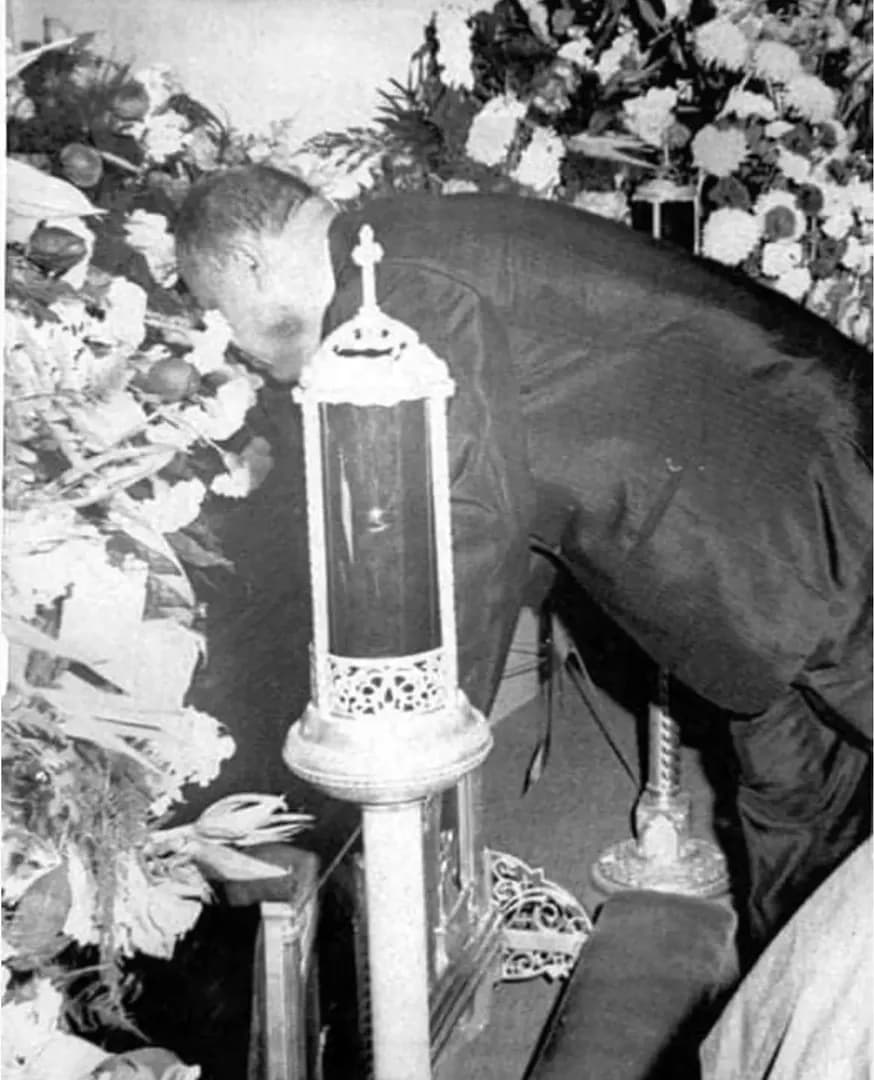 “God is getting himself a beautiful man.” (1969). Joe Louis kisses the casket of the undefeated boxer Rocky Marciano (49-0). Marciano was as gentle outside the ring, as he was unstoppable inside it. A