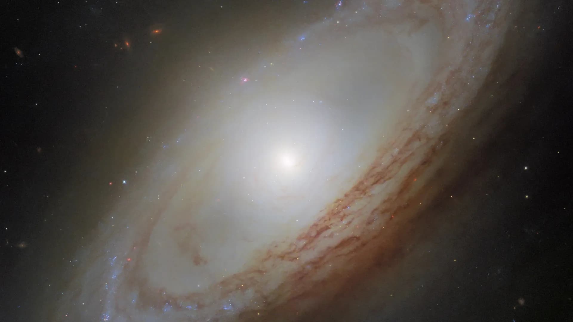 NASA's Hubble sees an exotic spiral galaxy spinning two ways at once
