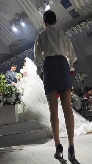 It looks simple, but the timing, arc, and sheer perfection of throwing those rose leaves perfectly over the bride and groom is genuinely satisfying